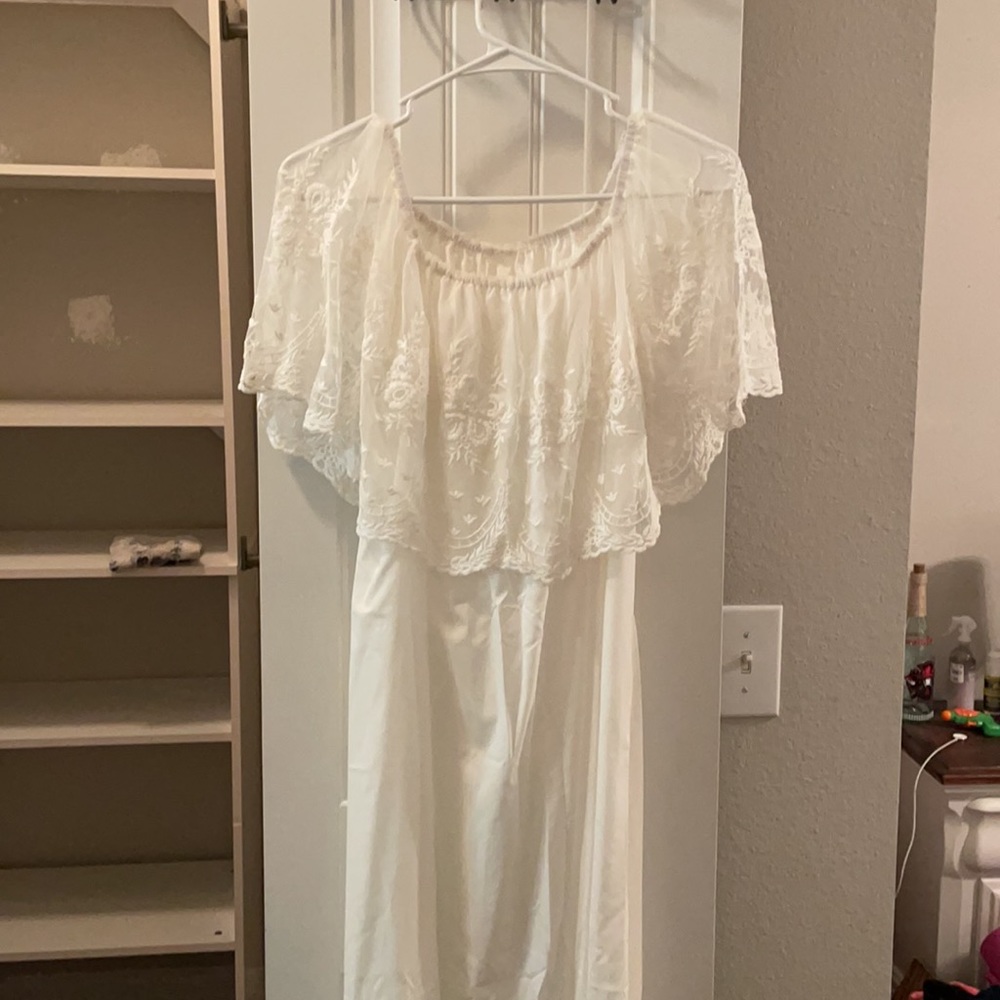 White off the shoulder dress. Can be a beach wedding dress.